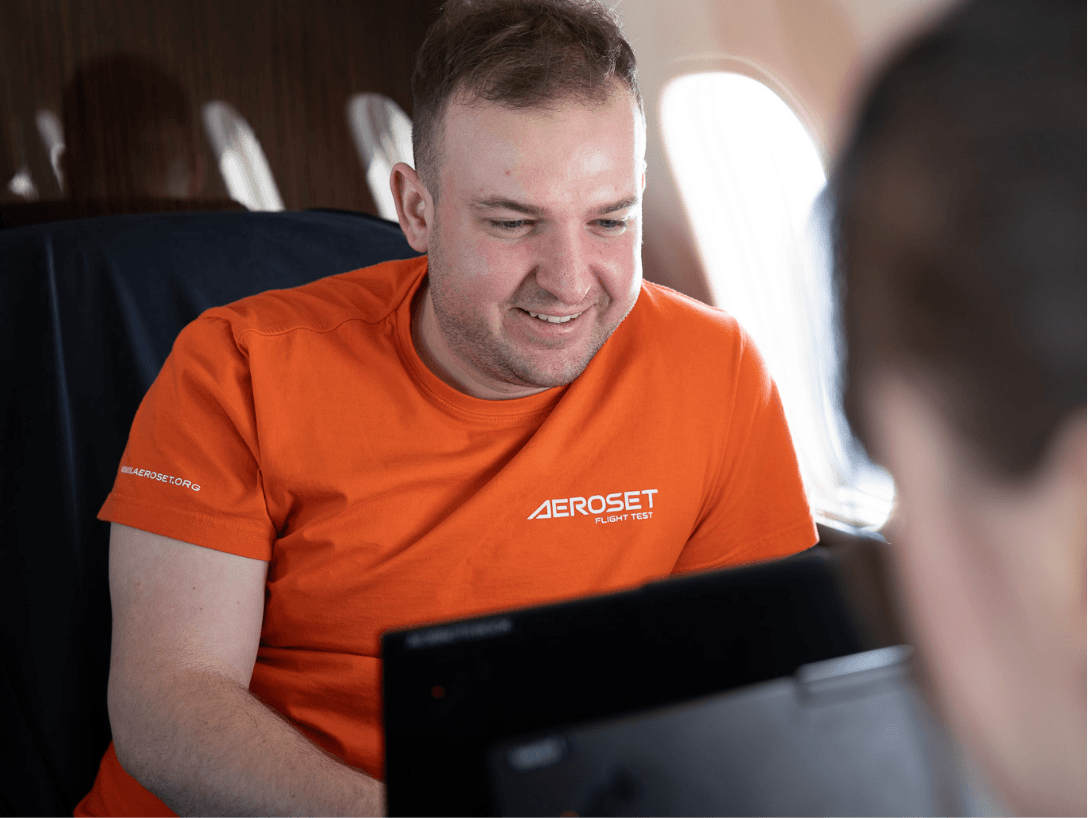 Aircraft certification support with engineers reviewing test results and compliance documentation