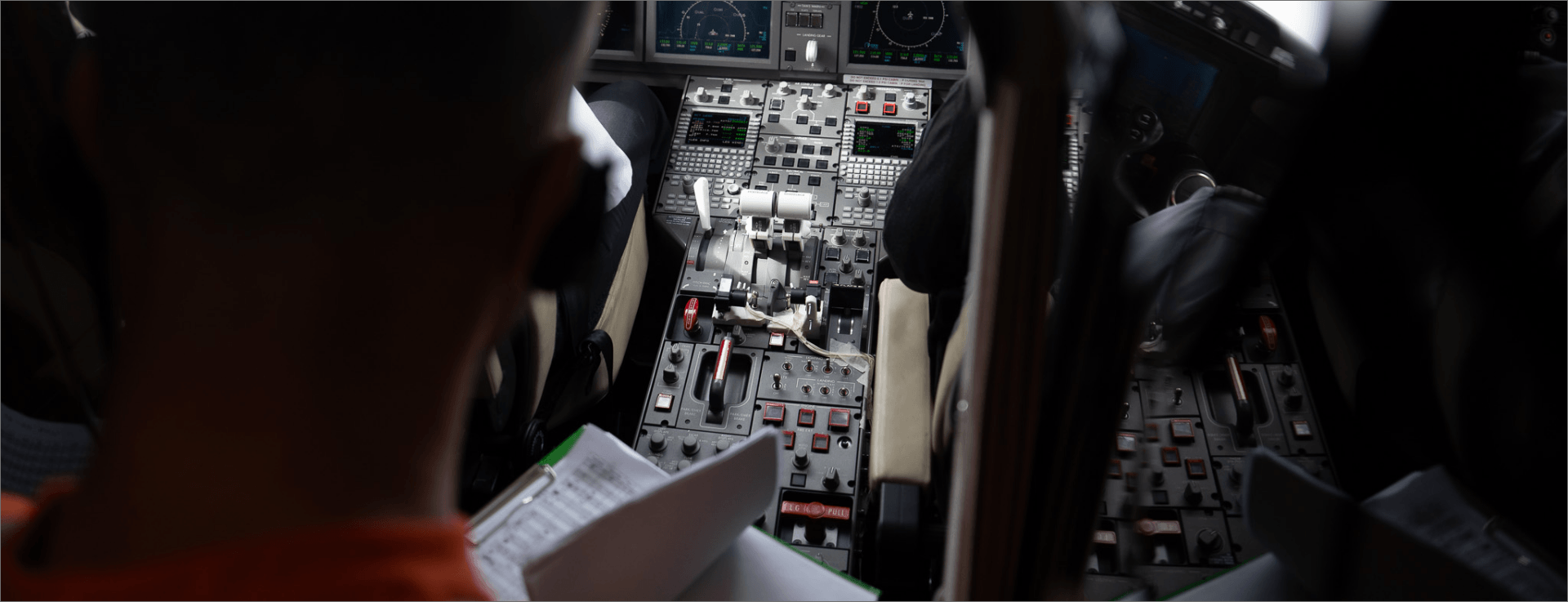 Aircraft flight test campaign with engineers monitoring cockpit instruments and performance data